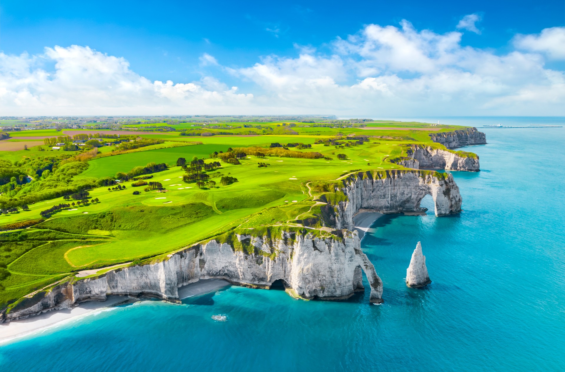 Picturesque panoramic landscape on the cliffs of Etretat. Natural amazing cliffs. Etretat, Normandy, France, La Manche or English Channel. Coast of the Pays de Caux area in sunny summer day. France